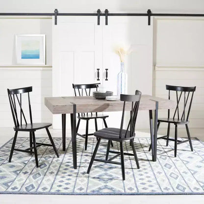Tavolo da pranzo moderno con piano in legno massello e base in metallo